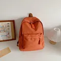 Minimalist vibrant orange casual backpack with woven zipper pulls for students - Orange