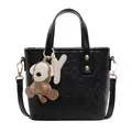 Black quilted leather bucket bag with top handle and detachable crossbody strap - With Pendant / Black