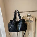 Large black leather tote bag with multiple pockets and adjustable shoulder strap - 39/25/15cm / Black