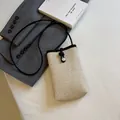 Straw mini crossbody phone bag with black cord strap and pearl button detail - Black Leather Silver Clasp