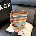 Colorful woven bucket bag with rainbow stripes, leather strap and strawberry charms - Brown with Pendant