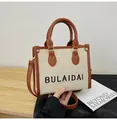 Retro Canvas-Einkaufstasche in Beige mit braunem Lederbesatz und verstellbarem Riemen - Klein / Braun