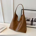 Minimalist large capacity shoulder tote bag in caramel brown textured soft leather - Brown