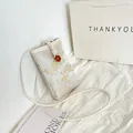 Mini crossbody phone bag with traditional cloud embroidery and floral jacquard patterns - Brown Buckle White