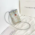 Light blue jacquard phone bag with gold embroidery and red flower button - Brown Buckle Blue