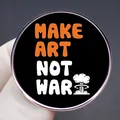Make Art Not War enamel pin badge featuring a mushroom cloud design on a black background - Make Art Not War Slogan