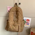 Brown quilted backpack with bow embroidery and tassel zippers for a chic casual style - No Charms / Khaki