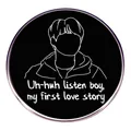 Round metal enamel pin with minimalist line art portrait and lyrics on black background - My First Love Story Theme