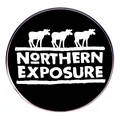 Round Northern Exposure metal badge with three moose silhouettes on a black background - Moose Pattern (Northern Exposure)