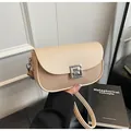 Detail of saddle bag showing cream leather, khaki woven texture, and silver G buckle - One Size / Khaki