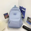 Minimalist large capacity backpack in light blue with side pockets and padded straps - Blue