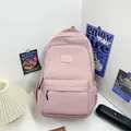 Lightweight pink nylon backpack for students featuring large capacity and durable straps - Purple Pink