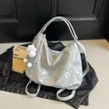 Silver marble pattern tote bag with plush cloud charm and metallic finish on leather jacket - Silver
