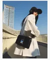 Minimalist black leather crossbody bag for women with silver metal buckle and strap - Black