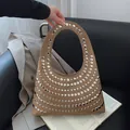 Khaki hobo bag with silver rivet studs for women shown in a lifestyle setting - Khaki
