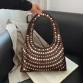Brown leather tote bag with silver metal rivets and unique round cutout handle - Brown