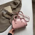 Pink embossed mini Boston handbag with dual top handles and detachable shoulder strap - Pink