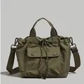 Bolso saco de nailon verde militar con cordón, correa ajustable y un bolsillo frontal grande - Verde Frijol