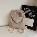 Beige waffle texture drawstring backpack with creative hoodie design and side arm details - Off White