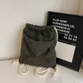 Olive green drawstring backpack in waffle texture fabric with unique hoodie hood design - Olive Green
