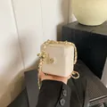 Creamy white quilted mini box bag with golden chain and flower metal clasp for kids - Off-white