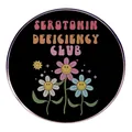 Round metal badge featuring Serotonin Deficiency Club text and smiling daisies - Serotonin Deficiency Club Style