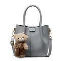 Grey pebbled leather underarm bucket bag with gold hardware and plush bear charm - Blue