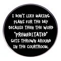 Round black enamel pin with white text Don't Plan Too Much in a silver metal frame - Don't Make Too Many Plans