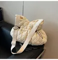 Detail of cream white quilted puffy tote with black drawstring and wide canvas strap - Off White