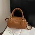 Sac seau marron en similicuir avec logo YDX doré et bandoulière réglable pratique - Sac Boston Cylindrique Caramel Porté Main et Bandoulière (SN&918) / Marron