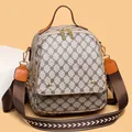 Retro dames rugzak met beige monogram print en stijlvolle bruine lederen details - Grijs