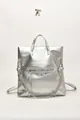 Modern metallic silver backpack with bold metal chain and reflective surface finish - Silver