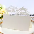 Elegant white laser-cut wedding place card with a romantic European carriage design - Ivory