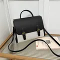 Vintage-Kuriertasche aus schwarzem Leder und beigem Canvas mit goldenen Schnallen - Schwarz und Weiß