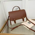 Retro-Schulranzen aus braunem Leder und Canvas mit Doppelschnalle und Handgriff - Braun und Weiß