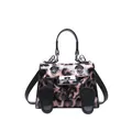 Detail of pink leopard print mini handbag featuring creative cartoon face and silver hardware - Pink
