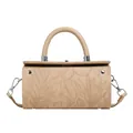 Detailed close-up of beige cylindrical bag with floral embossing and silver hardware - Khaki