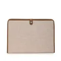 Detail of minimalist canvas file bag with brown leather trim and metal snap closure - Khaki