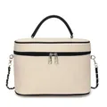 Detail of canvas vanity case featuring black leather trim and metal chain strap - White