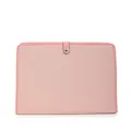 Close-up of pink canvas document bag with leather strap and silver metal buckle closure - Pink
