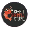 Round metal enamel pin featuring a cute red cartoon shrimp and Keep It Shrimple Stupid text - Keep It Shrimple Style