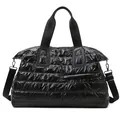 Quilted black puffer travel tote bag with metallic finish and adjustable strap - Black