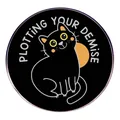 Funny black cat enamel pin featuring the text Plotting Your Demise on a white background - Black Cat Plotting Your Demise
