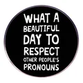 Black round enamel pin badge with white text about respecting other people's pronouns - A Pronoun For Respecting Others