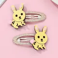 Détail de barrettes lapin jaune avec pompons roses et pinces BB enveloppées de tissu - Jaune