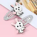 Lot de deux barrettes lapin blanc avec pompon rose et ruban tissé argenté pour enfants - Blanc