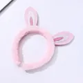 Cute pink plush rabbit ear headband with glitter details for girls on white background - Pink