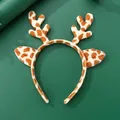 Detail van rendiergewei hoofdband met giraffenprint van pluche stof en oranje vlekken - Luipaardprint Geweit