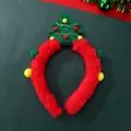 Detailed view of a plush Christmas tree headband with red velvet and colorful pom-poms - Christmas Tree Style