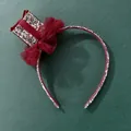 Détail d'un nœud en résille rouge et mini haut-de-forme à paillettes sur serre-tête - Rouge
